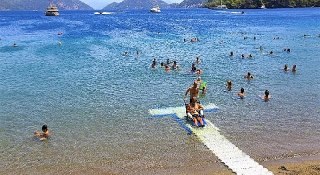 Muğla Büyükşehir ile Engelsiz Plajlar artıyor, engeller azalıyor